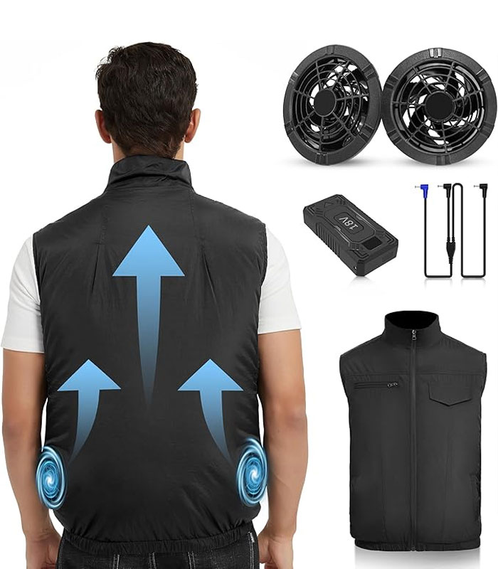 Man wearing a black cooling vest with built-in fans and battery pack, a weird invention for personal cooling.