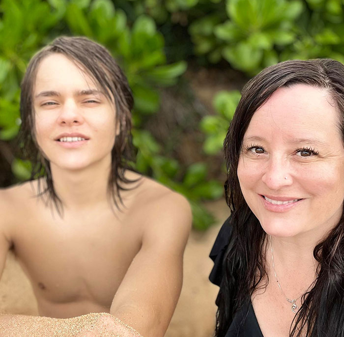 Young shirtless teen and woman with wet hair smiling outdoors, related to Idaho teen sniper Instagram story and motive revealed.