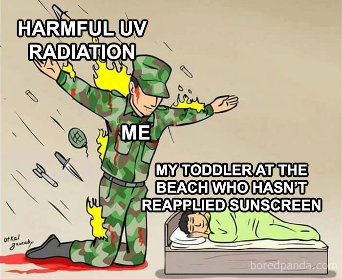 Dad protecting toddler from harmful UV radiation, showcasing wholesome and funny dads doing their best at the beach.