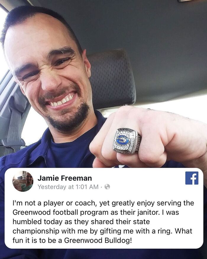 Man happily showing championship ring gifted by a football team, representing wholesome people and animals making the world better.