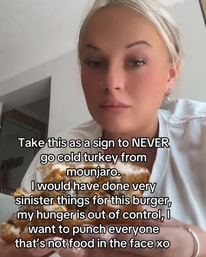 Woman eating a burger while documenting her out of control hunger after quitting Mounjaro cold turkey. - 4