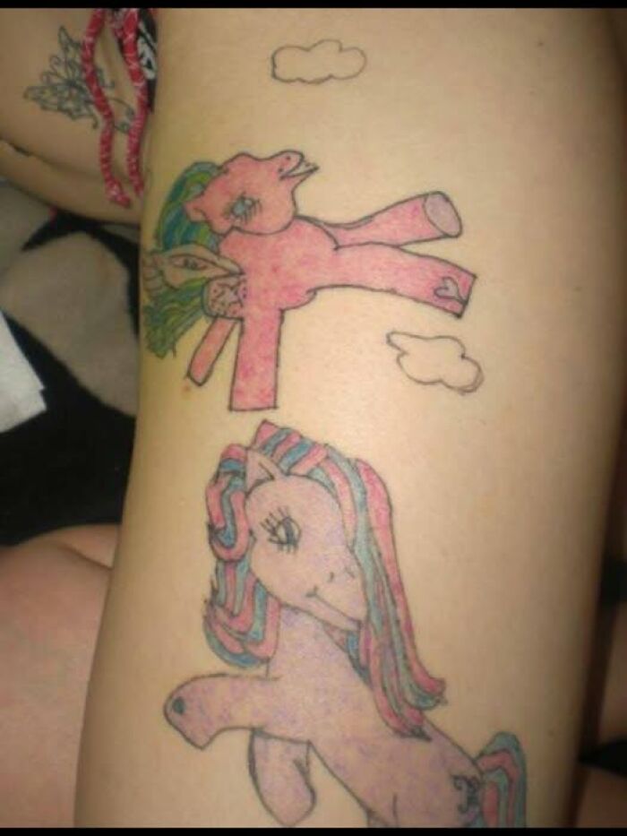 Tattoo of two poorly drawn ponies with uneven lines and awkward proportions, showcasing an abysmally bad tattoo example.