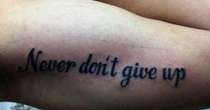 Tattoo with incorrect grammar reading never don’t give up, showcasing one of the worst abysmally bad tattoos.