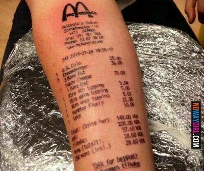Arm tattoo of a McDonald's receipt with detailed order items and prices, showcasing a bad tattoo example.