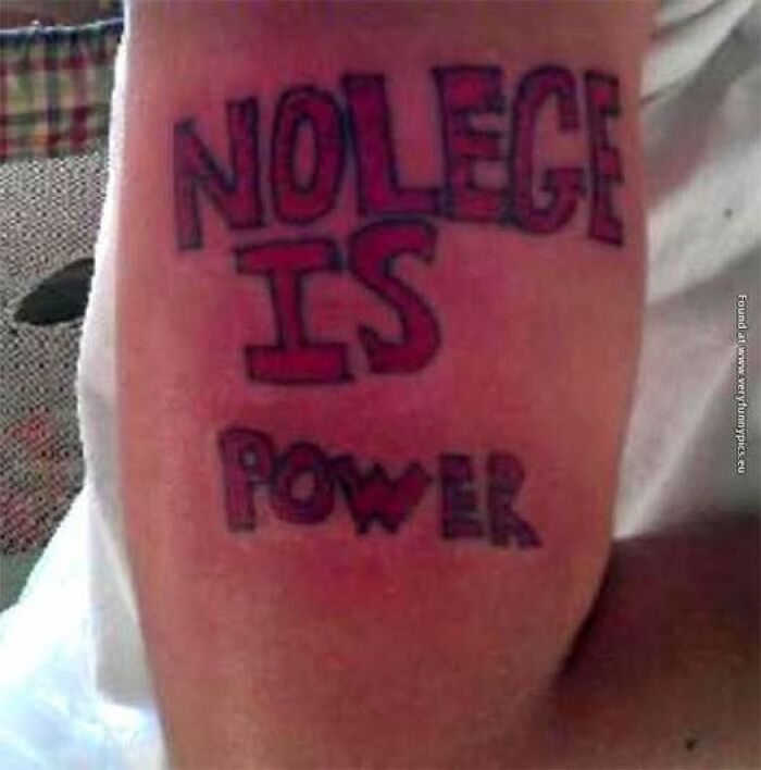 Tattoo on arm with misspelled phrase nolege is power showing an example of abysmally bad tattoos.