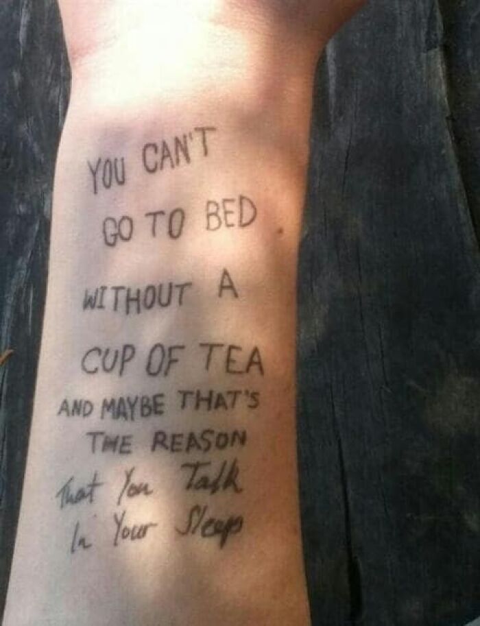 Tattoo of handwritten text with spelling errors on a person's arm, an example of abysmally bad tattoos and worst tattoo designs.