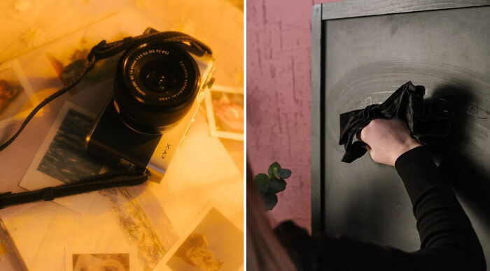Retro camera on a table with photographs next to a person cleaning a metal surface in a dimly lit room for would you rather poll 2