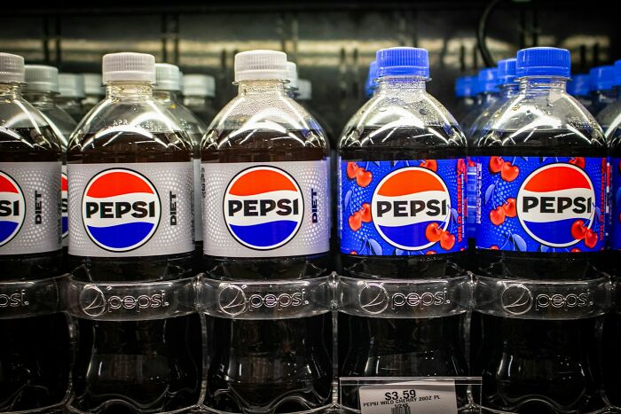 Bottles of Pepsi products on a store shelf representing the theme of people who know pathological liars.