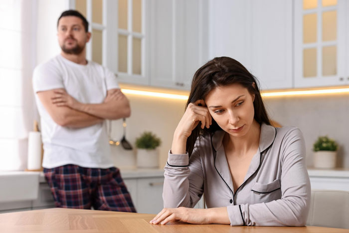 Man and wife in kitchen with tense mood, man orders wife to get a job amid allowance disagreement. Man and wife in kitchen with tense mood, man orders wife to get a job amid allowance disagreement.