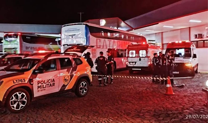 Police and emergency vehicles at a bus station during a strange incident involving a woman with 26 iPhones glued to her body. - 1