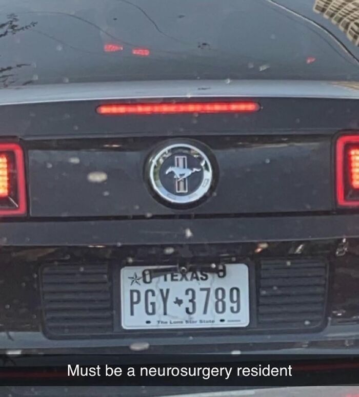 Rear view of a black Mustang with Texas license plate and medical meme caption about neurosurgery resident at checkup.