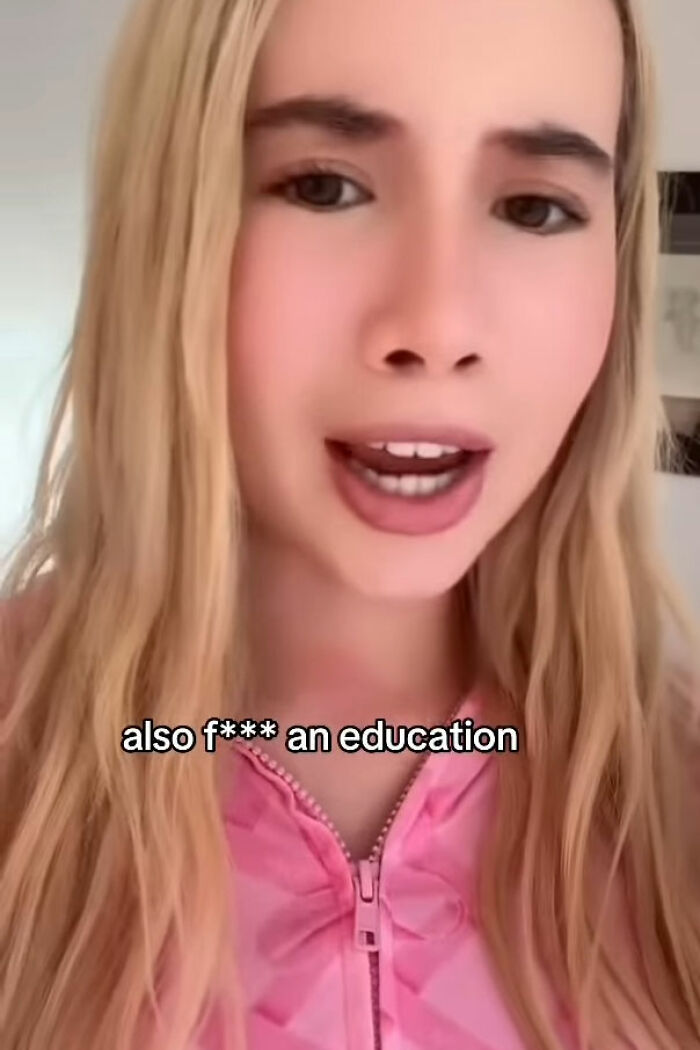 Young adult star speaking on camera wearing a pink top, discussing work and encouraging women to join OF platform. Young adult star speaking on camera wearing a pink top, discussing work and encouraging women to join OF platform.