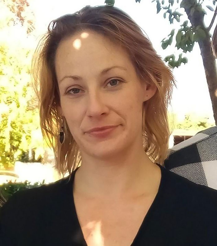 Woman with light brown hair outdoors near tree, related to bodies of missing mom and baby found after a month. Woman with light brown hair outdoors near tree, related to bodies of missing mom and baby found after a month.