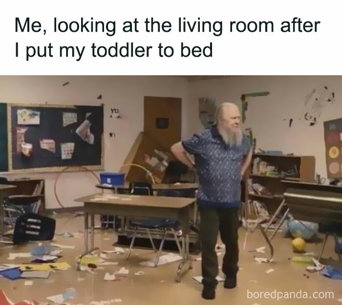 Man standing in messy room looking frustrated, capturing the reality of being a cool mom managing toddler chaos.