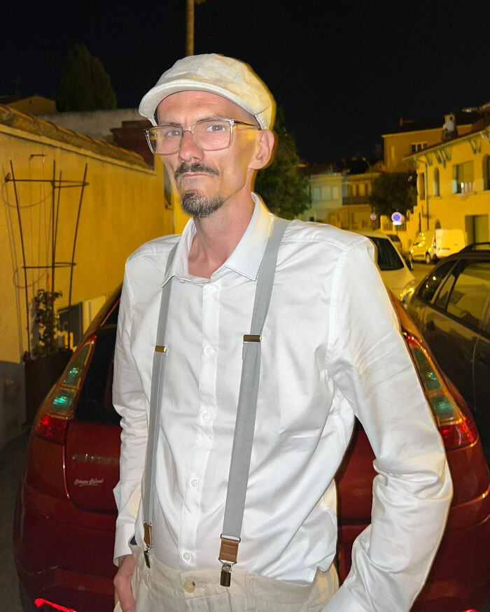 Man in white shirt and cap standing outside at night, representing famous streamer passing away live on air. Man in white shirt and cap standing outside at night, representing famous streamer passing away live on air.