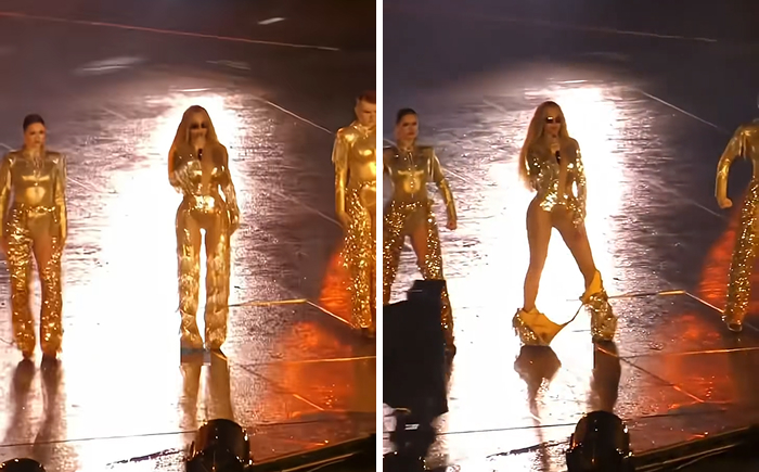 Singer in gold outfit experiencing a wardrobe malfunction on stage during a celebrity wardrobe malfunction moment.
