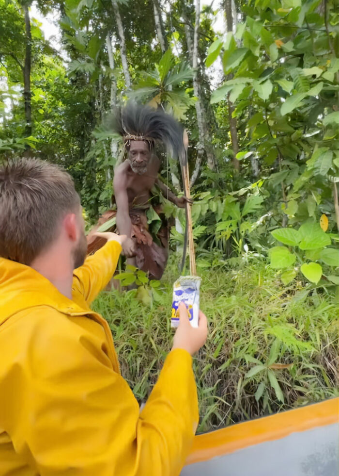 Man filming indigenous tribe member in forest, sparking outrage over viral TikTok stunt and cultural sensitivity concerns.