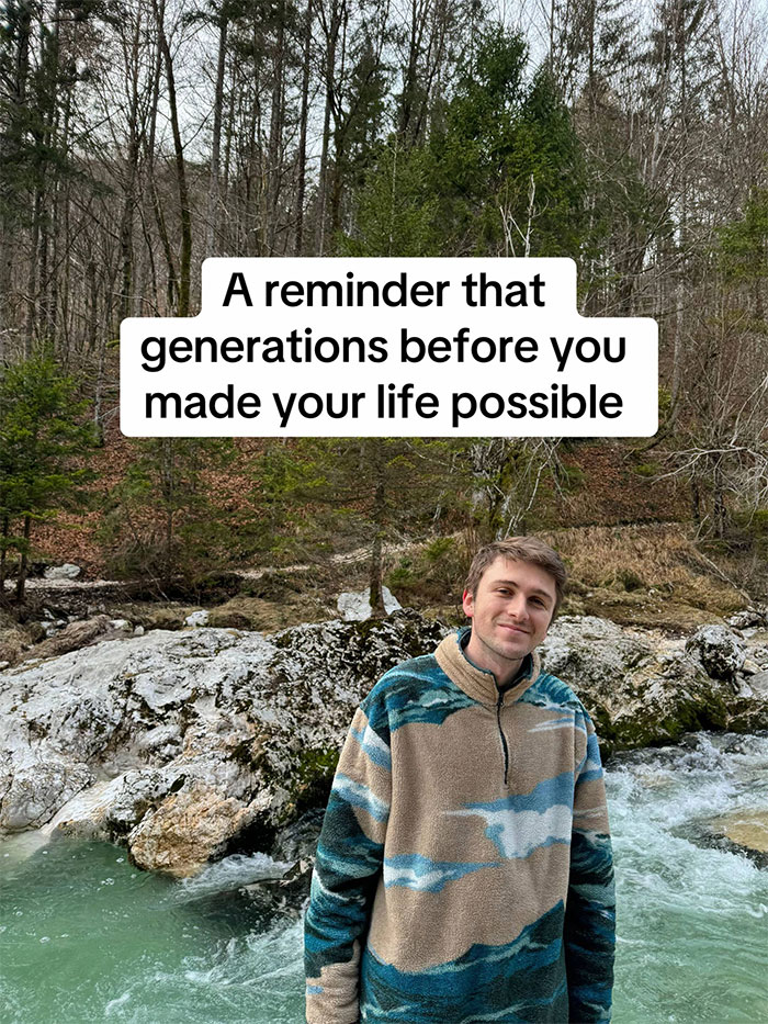 Young man by a river in nature reflecting on family history and the impact of ancestors on his life.