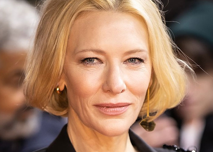 Close-up of a blonde woman at an event, illustrating celebrity encounters and unforgettable experiences with a total gentleman.