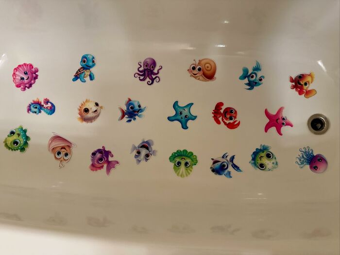 Colorful ocean-themed decor pieces with cute sea creatures arranged inside a bathtub for magical home decoration.