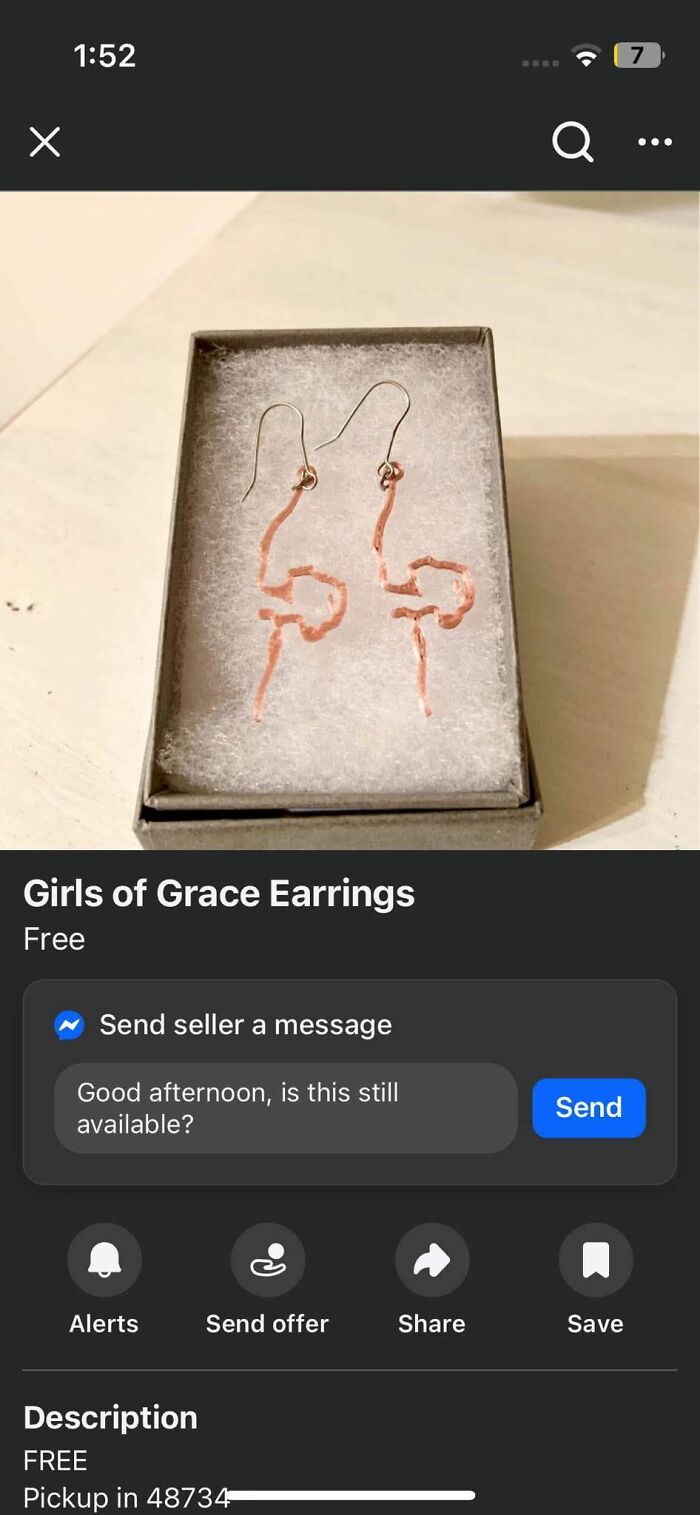 Earrings made from copper wire in a rough, abstract shape displayed as a craft shaming DIY project example.