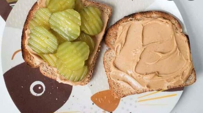 Peanut butter sandwich with pickles on whole grain bread, a food nobody should eat for physical and mental health.