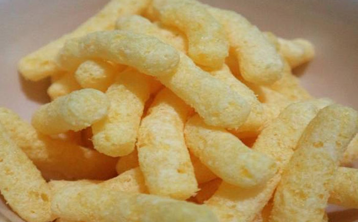 Close-up of puffed corn snacks resembling unusual shapes seen by professionals who work in other people’s homes