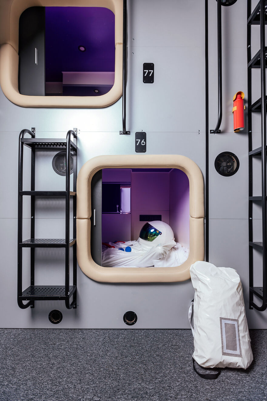 Compact capsule room with astronaut suit inside, illustrating claustrophobia and tight enclosed spaces concept. Compact capsule room with astronaut suit inside, illustrating claustrophobia and tight enclosed spaces concept.