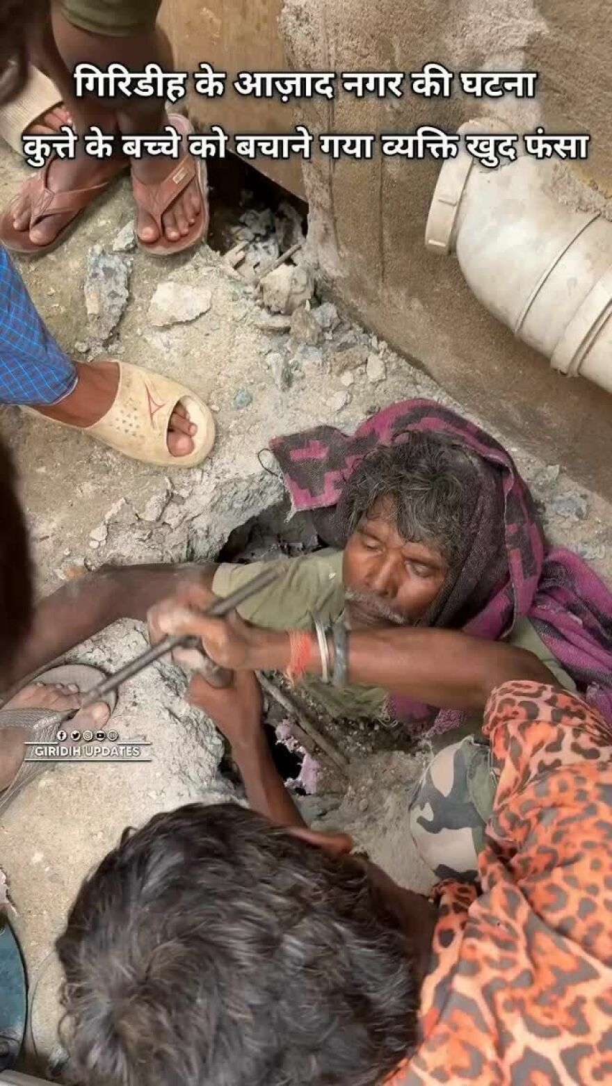 Man trapped in a narrow hole while rescuers assist, showing a real-life claustrophobia story with tense and tight surroundings. Man trapped in a narrow hole while rescuers assist, showing a real-life claustrophobia story with tense and tight surroundings.