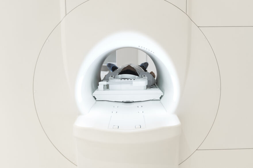 Patient lying inside an MRI machine, illustrating a real-life claustrophobia experience in a medical setting. Patient lying inside an MRI machine, illustrating a real-life claustrophobia experience in a medical setting.