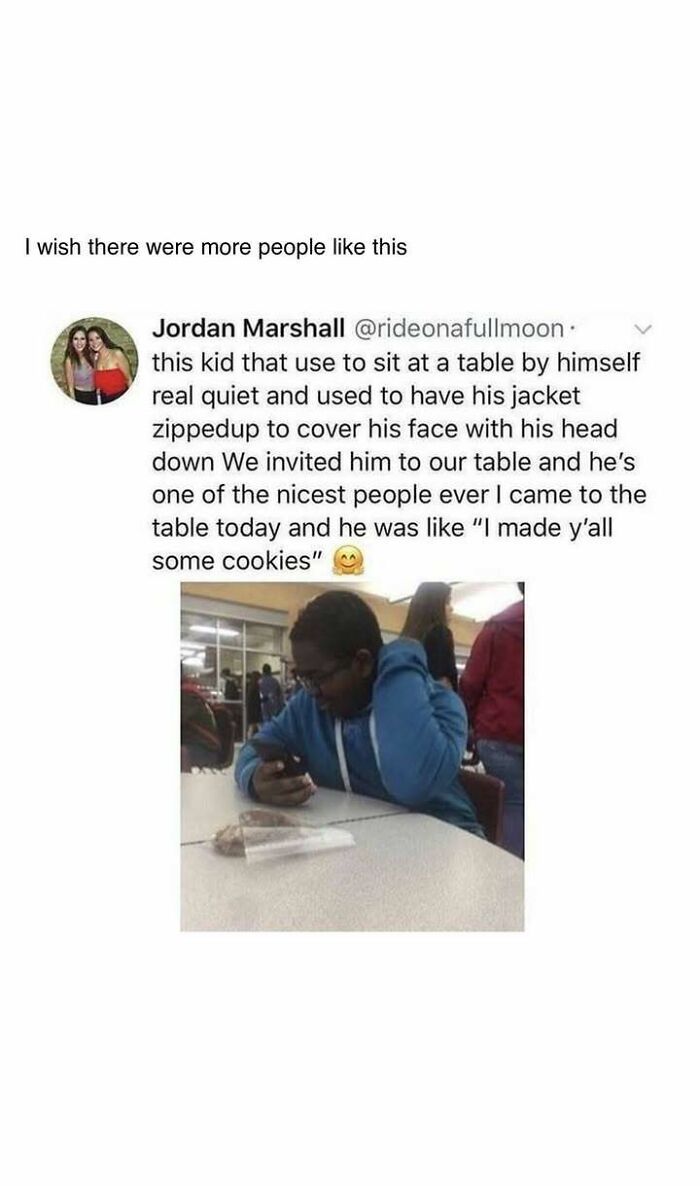 Boy in blue hoodie sitting at table with cookies, sharing a heartwarming post about kindness and warm moments.
