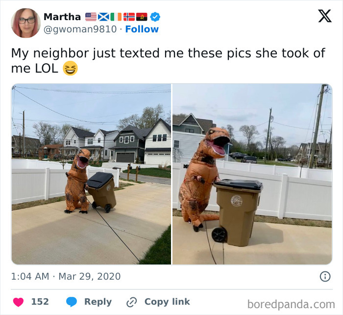 Person in a dinosaur costume taking out the trash outside in a neighborhood, showing wholesome kind neighbors humor.