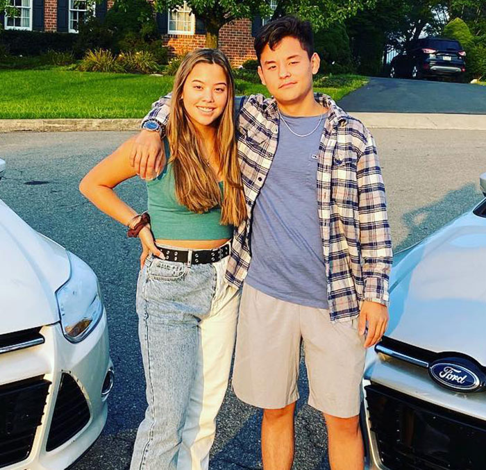 Teen siblings standing outdoors between two cars, relating to Kate and Jon Gosselin&rsquo;s son Collin&rsquo;s heartbreaking message.