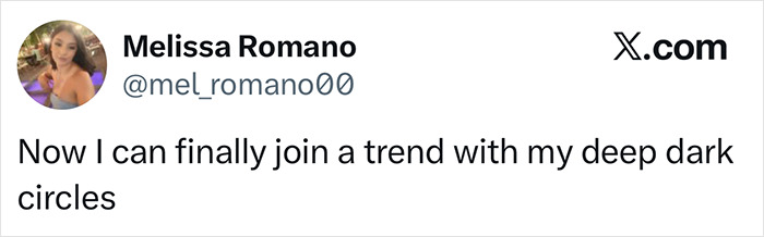 Tweet from Melissa Romano about joining the tired girl beauty trend with deep dark circles, reflecting the viral Gen Z trend.