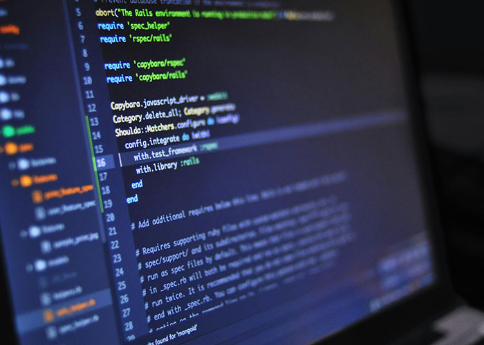 Close-up of a laptop screen displaying code, representing jobs related to a person without a soul in tech fields.