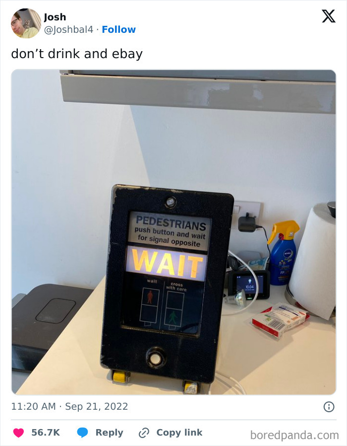 Pedestrian crossing button with illuminated WAIT sign indoors, humorous chaotic British meme about daily life in the U.K.