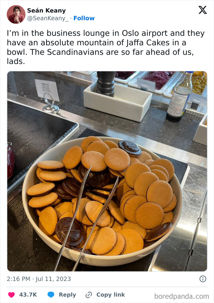 Bowl overflowing with Jaffa Cakes in an airport lounge, illustrating funny memes about life in the UK.