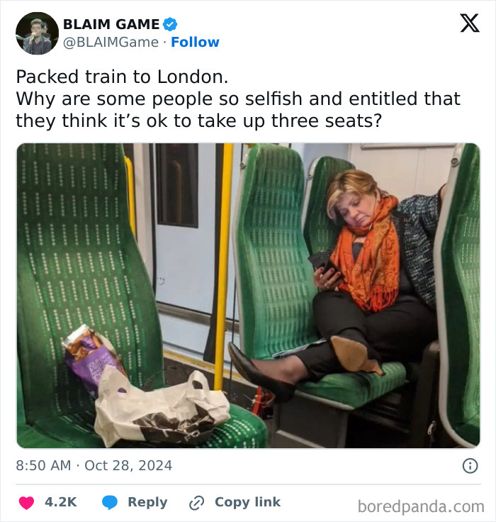 Woman on a packed train showing selfish behavior by taking up three seats and making life harder for others.