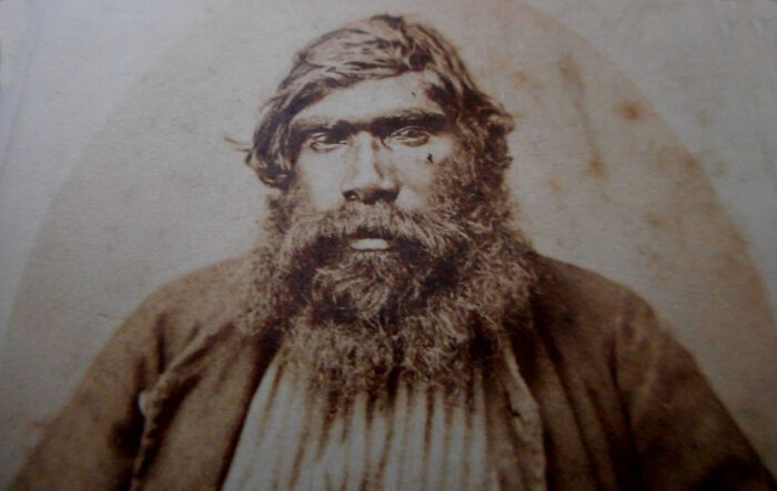Portrait of a 1900s Indigenous Australian man with a beard, offering rare glimpses into early Indigenous Australian life.
