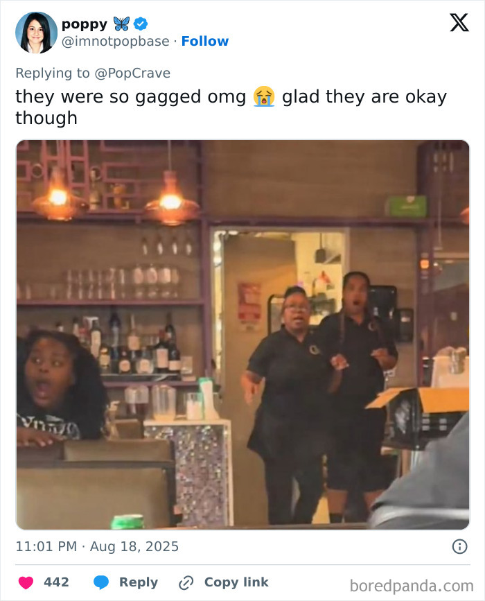 Three shocked restaurant staff members reacting to terrifying footage of an SUV crashing near diners inside.