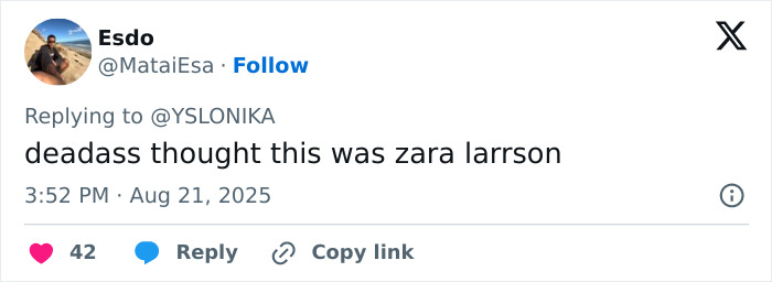 Tweet from Esdo replying to YSLONIKA, expressing surprise that the singer appears unrecognizable in new video.