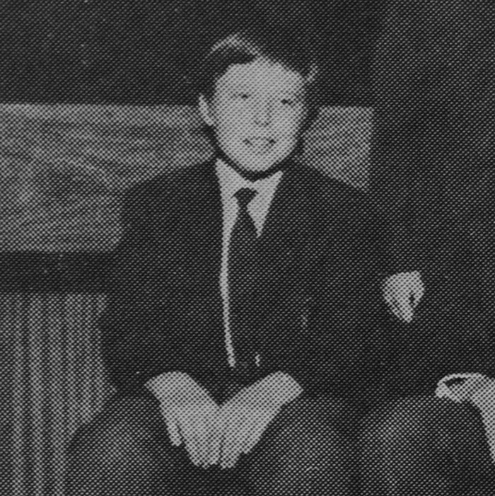 Black and white image of a young boy in formal attire related to 40-year-old Kenyan man's Elon Musk eldest son claim. - 7