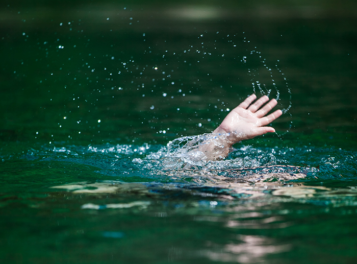 Hand reaching out of water, symbolizing a woman shocked to find out her mother-in-law hates her after losing husband. - 7