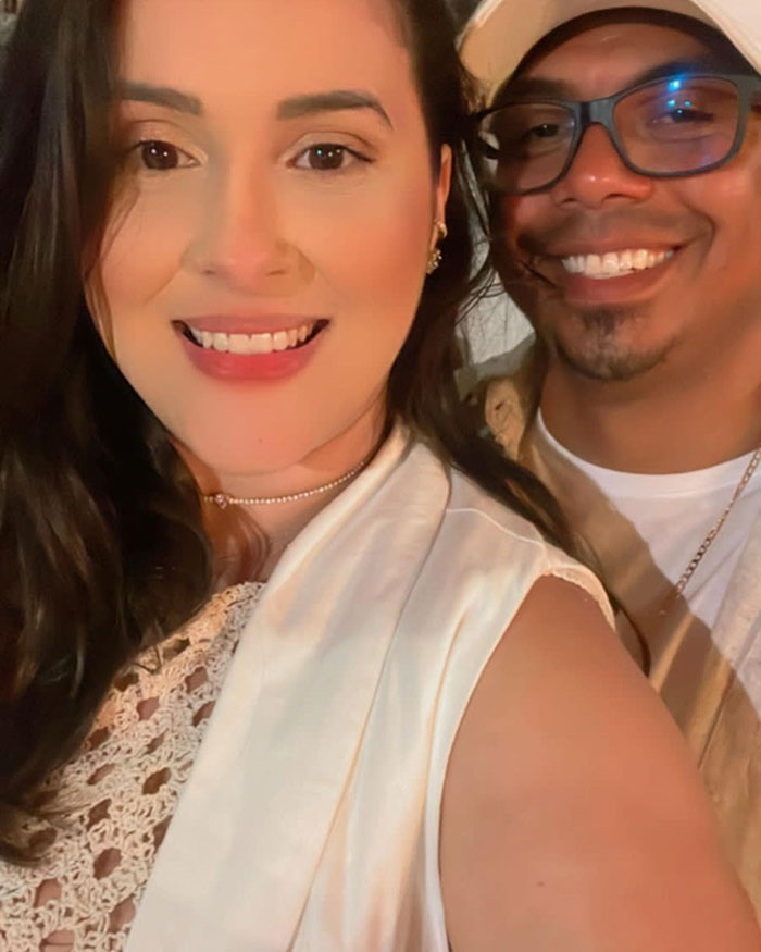 Couple smiling in a close-up photo, highlighting the tragic 2-year-old drowning incident while dad is streaming.