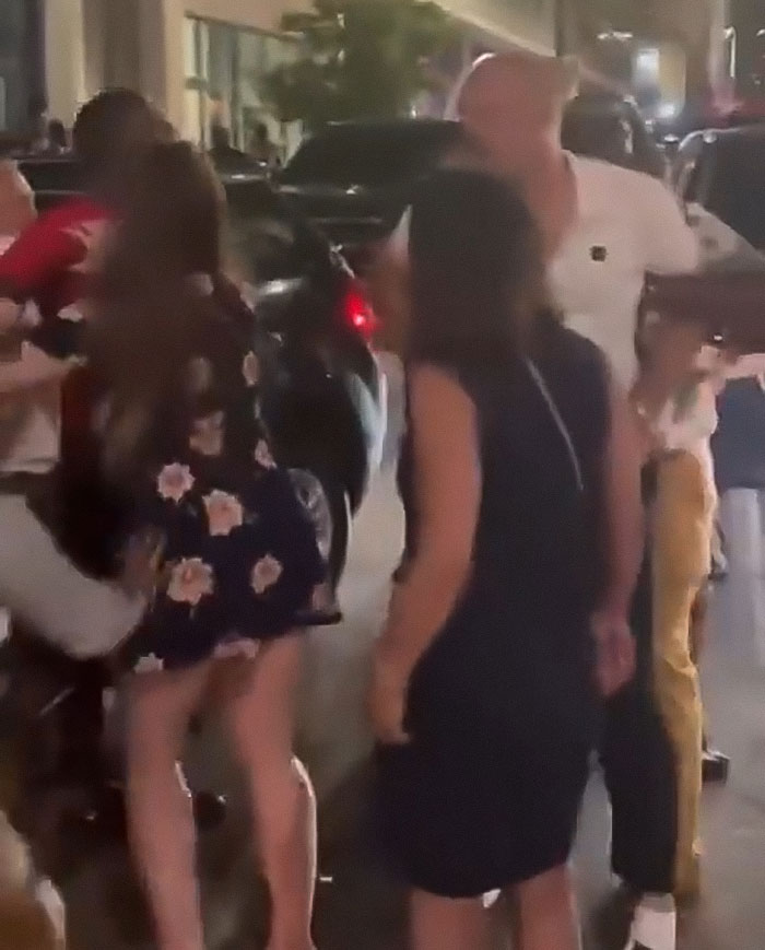 Crowd gathered on street at night as single mom confronts Cincinnati mob incident under police chief scrutiny. Crowd gathered on street at night as single mom confronts Cincinnati mob incident under police chief scrutiny.