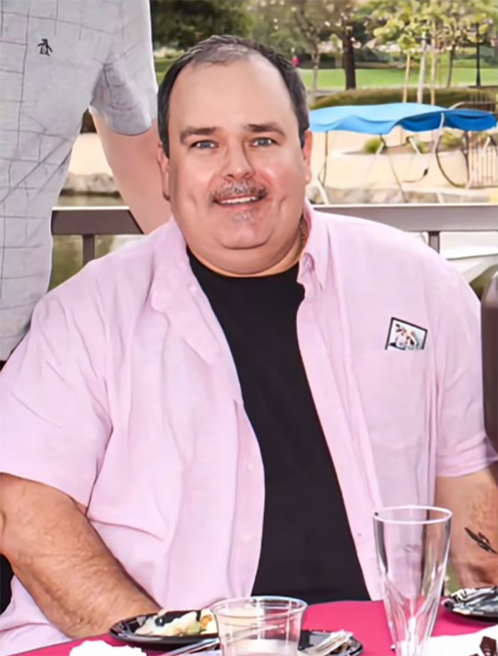 Man smiling outdoors sitting at table after Mexico facelift procedure, showing noticeable facial changes. Man smiling outdoors sitting at table after Mexico facelift procedure, showing noticeable facial changes.