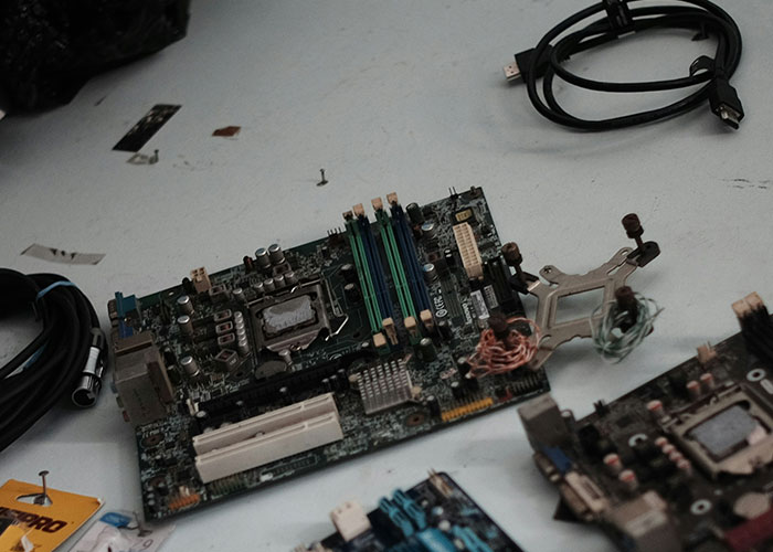 Computer motherboards and cables scattered on a flat surface, unrelated to wild and embarrassing drinking stories.