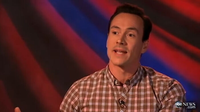 Man in a checkered shirt speaking in an interview, related to celebrities Hollywood tried to make leading A-listers.