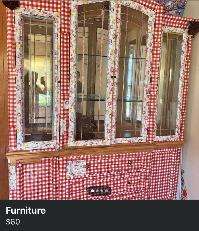 Vintage cabinet covered in mismatched floral and checkered fabric, an example of horrendous DIY craft shaming project.