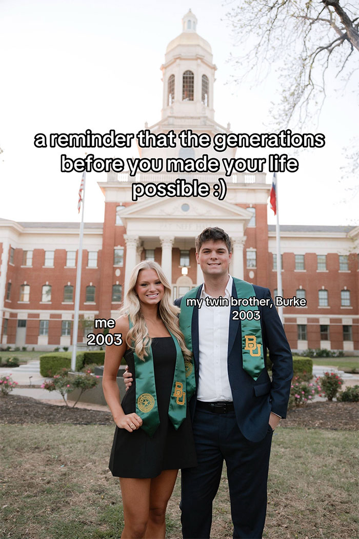 Two graduates wearing green family historian stoles standing in front of a historic building, celebrating family heritage.